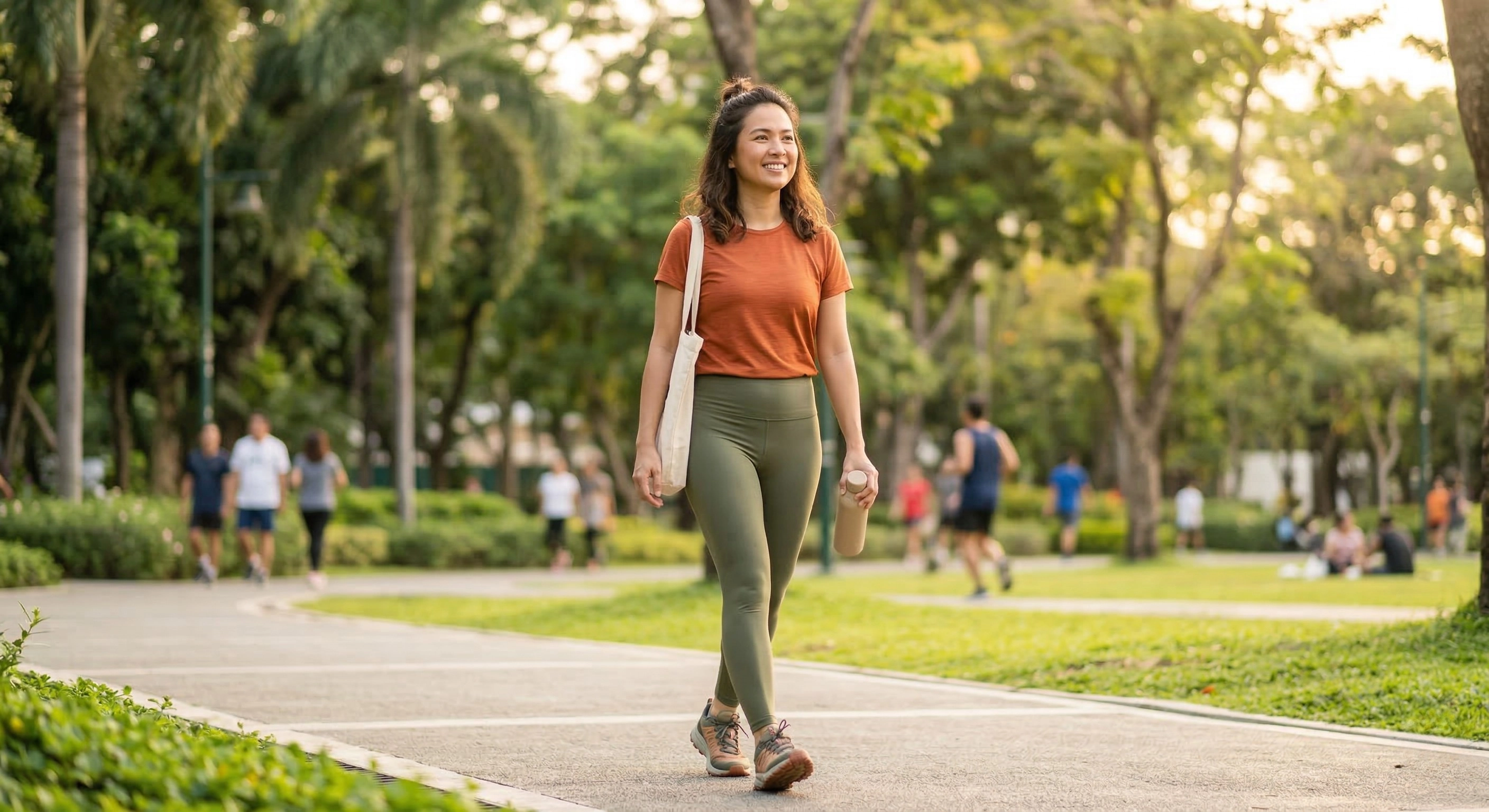 Confident active Filipino woman walking outdoors