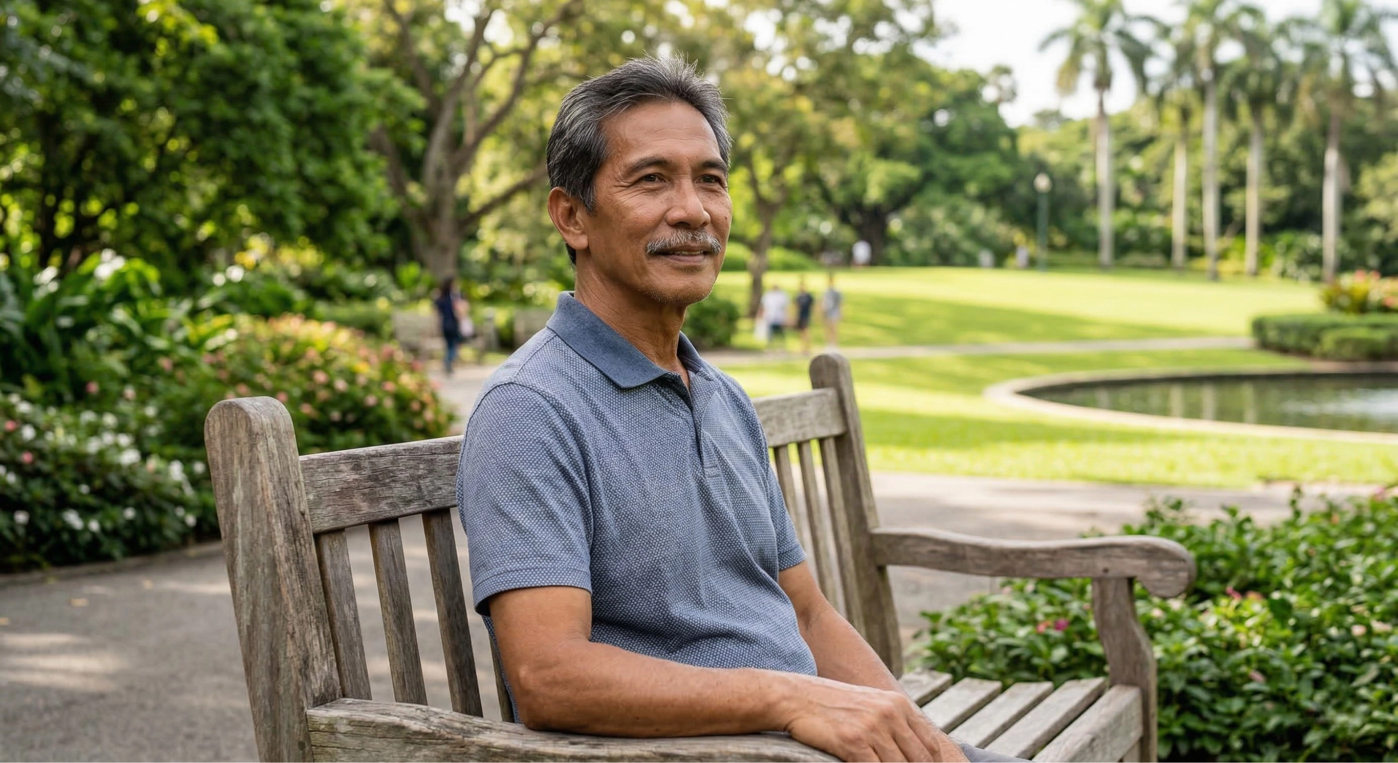 Distinguished Filipino man in a park representing post-prostatectomy recovery treatment